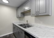 Thumbnail 27 of 30 - kitchen with granite countertops at Swiss Gables Apartment Homes, Kent