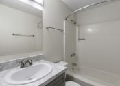 Thumbnail 29 of 30 - Bathroom with Sink and Shower with Tub at Swiss Gables Apartment Homes, WA 98032