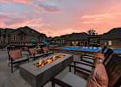 Thumbnail 46 of 75 - a backyard patio with a fire pit and lounge chairs  at Griffin Weston, North Carolina, 27513