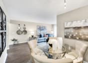 Thumbnail 3 of 31 - a living room with a glass table and chairs  at Northridge, Rochester Hills, MI