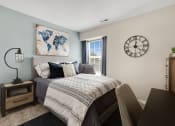 Thumbnail 8 of 31 - a bedroom with a large bed and a large window  at Northridge, Rochester Hills