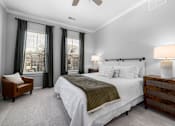 Thumbnail 61 of 75 - a bedroom with a bed and two windows at Griffin Weston, Cary, 27513