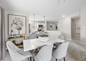 Thumbnail 3 of 24 - A dining room with a white table and chairs at Briarcliff Village, Michigan, 48390