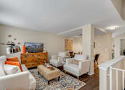 Thumbnail 8 of 36 - Living Room With TV at Mainstreet Village, Novi, MI, 48375