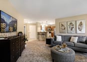 Thumbnail 1 of 22 - Living Room With TV at Amberly Apartments, Michigan, 48322