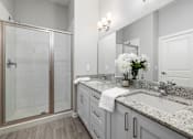 Thumbnail 11 of 75 - Primary Bath with Walk in Shower & Double Vanities at Griffin Weston, Cary, NC, 27513