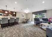 Thumbnail 20 of 22 - Living Room with a kitchen and a dining table at Amberly Apartments, West Bloomfield, 48322