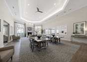 Thumbnail 20 of 34 - a large living room with a large table and chairs at Cidermill Village Apartments in Rochester Hills, MI 