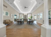 Thumbnail 18 of 34 - A spacious dining room with a large table and chairs at Cidermill Village Apartments in Rochester Hills, MI 