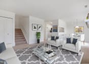 Thumbnail 4 of 15 - Living Room With Loft Staircase at Brownstones, Novi