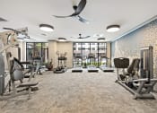 Thumbnail 17 of 19 - a fitness center with treadmills and other exercise equipment  at The Griffin Royal Oak, Michigan, 48067
