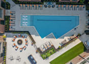 Thumbnail 19 of 19 - arial view of a resort style pool with lounge chairs and a fountain  at The Griffin Royal Oak, Royal Oak, Michigan