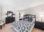 Thumbnail 15 of 31 - a bedroom with a large bed and two dressers  at Northridge, Michigan, 48307