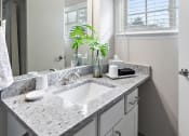 Thumbnail 25 of 31 - a bathroom with a sink and mirror  at Northridge, Rochester Hills, MI, 48307