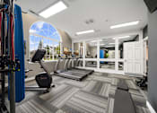 Thumbnail 23 of 23 - A gym with a treadmill, exercise bike, and other equipment.