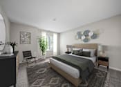 Thumbnail 8 of 23 - A bedroom with a large bed and a chair.