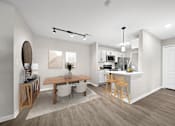 Thumbnail 7 of 23 - A modern kitchen with a dining table and chairs.