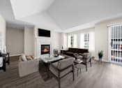 Thumbnail 1 of 23 - A modern living room with a fireplace and a brown couch.
