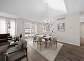 Thumbnail 2 of 23 - A modern dining room with a glass table and chairs.
