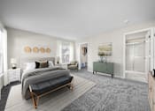 Thumbnail 4 of 23 - A bedroom with a large bed and a green bench.