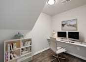 Thumbnail 15 of 34 - a home office with a desk and two computer monitors at Cidermill Village