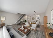 Thumbnail 6 of 17 - A living room with a grey couch and a wooden coffee table.