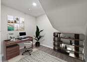 Thumbnail 4 of 16 - A home office with a desk, chair, and a plant.