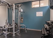 Thumbnail 4 of 25 - A gym with a blue wall and a sign that says "No Smoking".