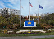 Thumbnail 53 of 53 - The Majestic sign is in front of a building with trees and flags.