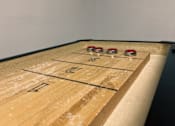 Thumbnail 45 of 62 - A shuffleboard court with the numbers 1 and 2 on it.