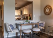 Thumbnail 9 of 62 - A dining area with a table and chairs.