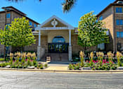 Thumbnail 62 of 62 - The front of The Iroquois Club with a clear blue sky above.