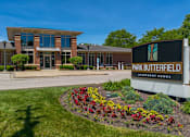 Thumbnail 43 of 43 - The image shows a building with a sign that reads "Park Butterfield Apartment Homes".
