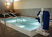 Thumbnail 23 of 73 - A pool with a blue cover and a ladder.