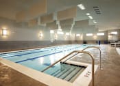 Thumbnail 21 of 73 - A large indoor swimming pool with lanes marked for swimming.