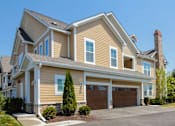 Thumbnail 64 of 73 - A large, two-story house with a garage and a driveway.