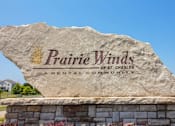 Thumbnail 72 of 73 - A large stone sign that says Prairie Winds in front of a house.
