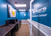 Thumbnail 25 of 25 - A room with computers and a sign that says Arbors Glen Ellyn Business Center.