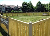 Thumbnail 24 of 25 - A fence with a sign that says Bark Park.