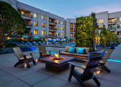 Thumbnail 6 of 18 - Outdoor courtyard with fire pit at AVE Clifton, Clifton, NJ