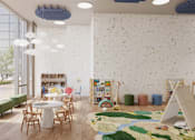 Thumbnail 8 of 14 - A room with a white table surrounded by chairs and a wall with a pattern of small objects.