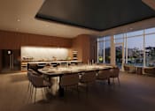 Thumbnail 7 of 14 - A modern dining room with a large table and chairs.