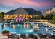 Thumbnail 1 of 13 - a large swimming pool with lounge chairs and a house in the background at AVE Las Colinas, Irving, TX