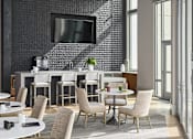 Thumbnail 17 of 19 - A modern dining room with a large table and chairs.