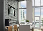 Thumbnail 19 of 19 - A modern kitchen with a view of the city.