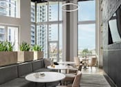 Thumbnail 18 of 19 - A modern dining area with a table and chairs.