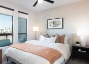 Thumbnail 17 of 20 - a bedroom with a large bed and a ceiling fan at AVE Phoenix Terra, Arizona, 85003