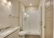 Thumbnail 16 of 18 - a bathroom with a shower and a sink and a toilet at The Augustan, Augusta, GA