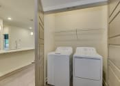 Thumbnail 12 of 18 - a washer and dryer in the laundry room of a house at The Augustan, Augusta