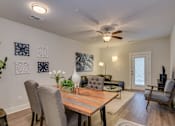 Thumbnail 2 of 12 - Dining area and living room at McHenry Square Apartments, Georgia